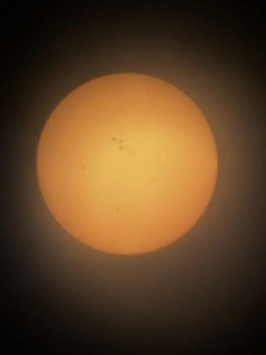 This was my first and only photo of the sun so far!. This image depicts the sun through a solar filter.