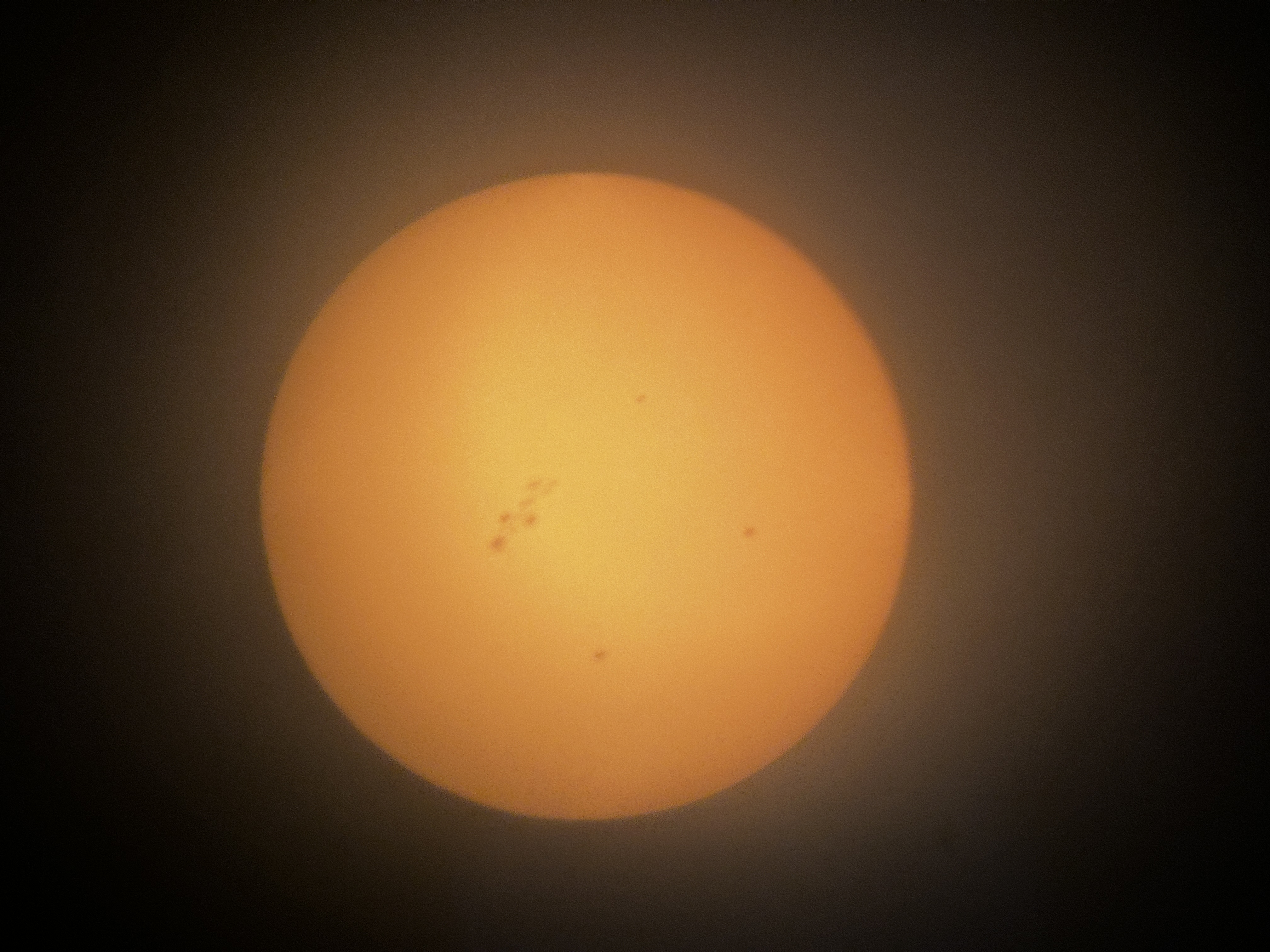 This was my first and only photo of the sun so far!. This image depicts the sun through a solar filter.
