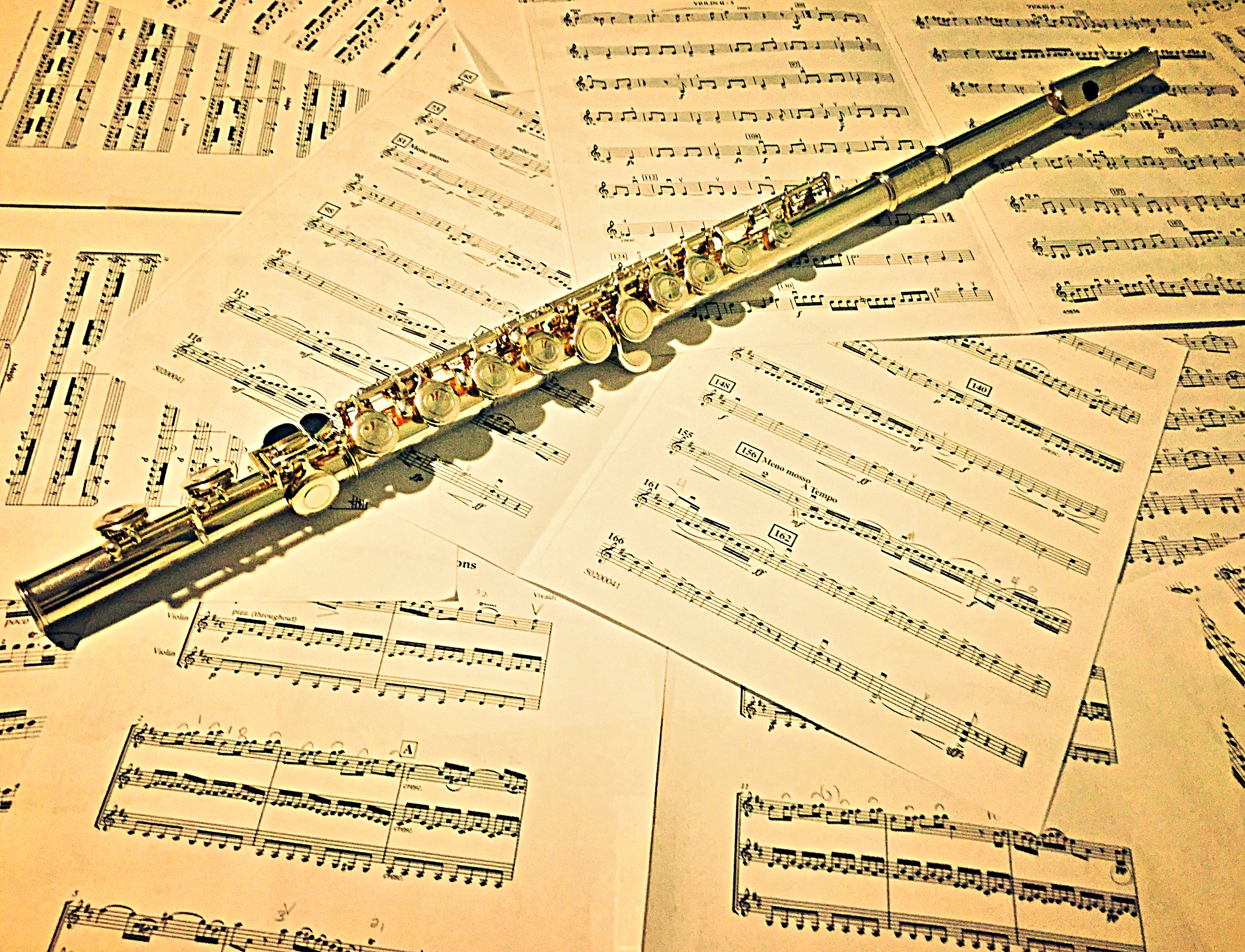 flute over sheet music