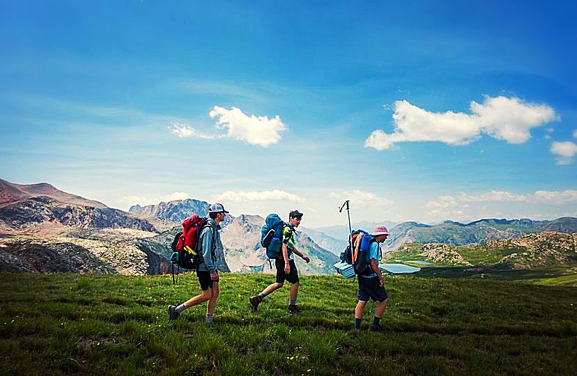Three (3) people hiking on the Continental Divide Trail (CDT) in Colorado